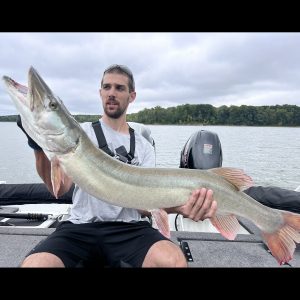 Muskie with angler and bucktail. how to catch a muskie with a bucktail