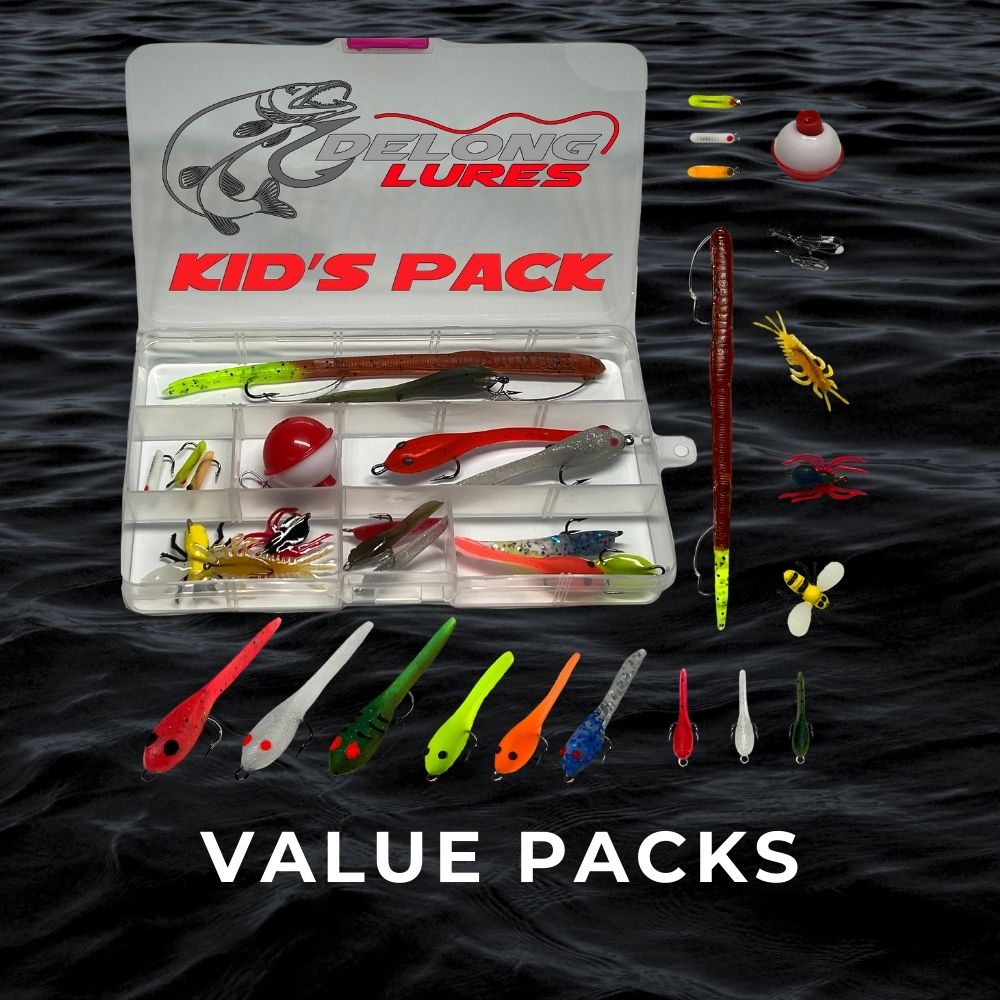 Fishing lure value pack with assorted soft plastics, hooks, and tackle in a clear box on dark water background