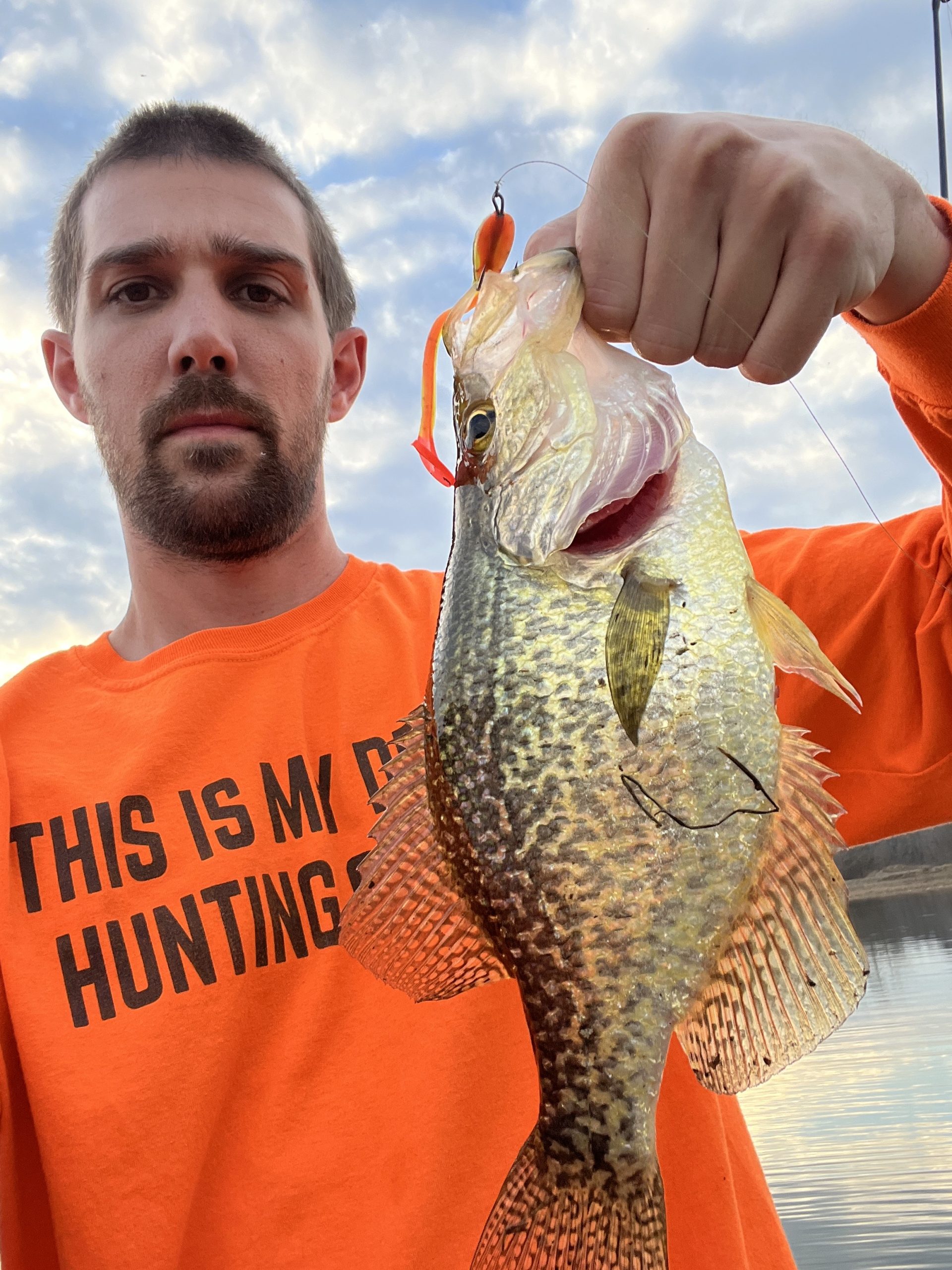 Angler holding a trophy-size crappie caught using DeLong Lures Twister Tad
