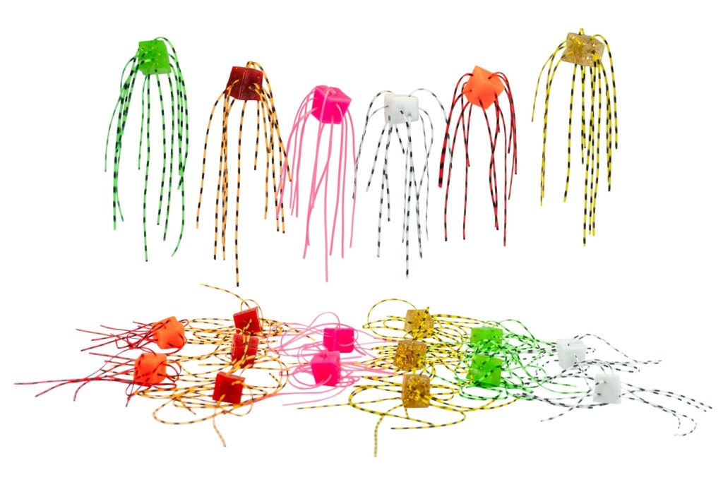 Cube-style dice baits with filament threads showing multiple colors used for finesse soft plastic fishing